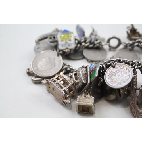 191 - Silver charm bracelet including coin charms (102g)