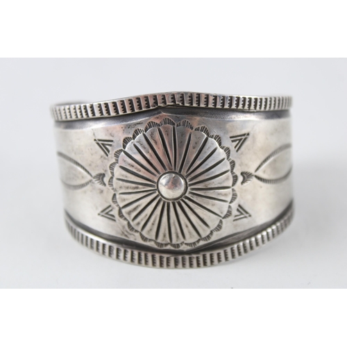 251 - A silver Native American design bangle (73g)