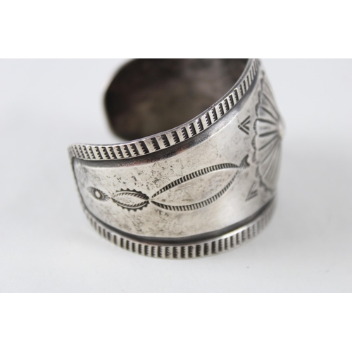 251 - A silver Native American design bangle (73g)