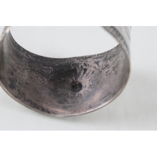 251 - A silver Native American design bangle (73g)