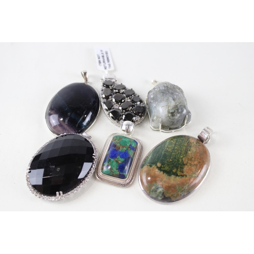 254 - Six silver mounted gemstone pendants (112g)