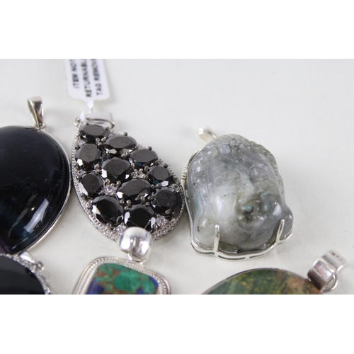 254 - Six silver mounted gemstone pendants (112g)