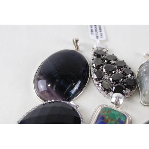 254 - Six silver mounted gemstone pendants (112g)