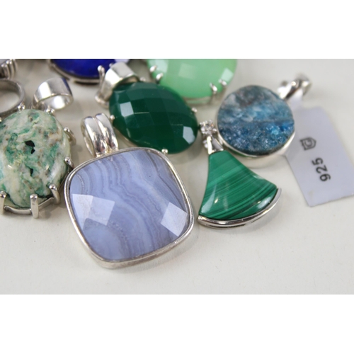 255 - Ten silver mounted gemstone pendants (61g)