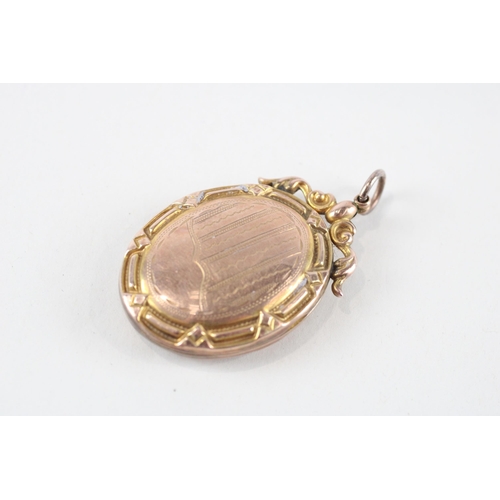 104 - 9ct gold back & front patterned locket (8.5g)