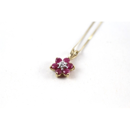 106 - 9ct gold ruby & diamond pendant & chain (1.1g)