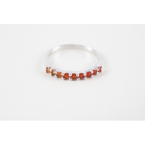 111 - 9ct white gold orange gemstone half eternity ring (1.2g) Size  M