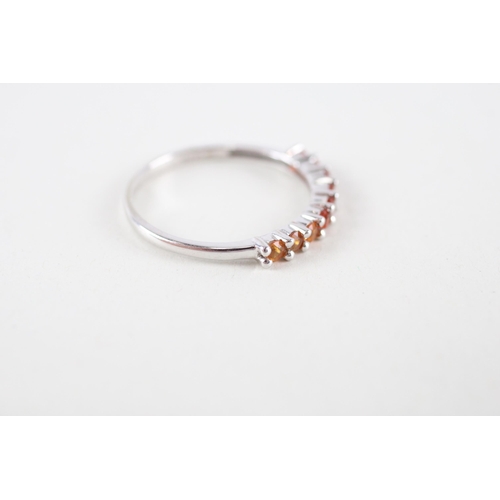 111 - 9ct white gold orange gemstone half eternity ring (1.2g) Size  M