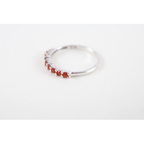 111 - 9ct white gold orange gemstone half eternity ring (1.2g) Size  M