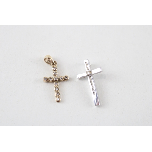 131 - 2 x 9ct gold white & yellow gold diamond cross pendants (1.5g)