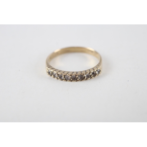 134 - 9ct gold synthetic spinnel half eternity ring (2.2g) Size  R