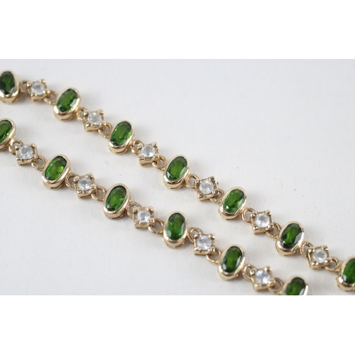 54 - 9ct gold peridot & white sapphire bracelet (8.1g)