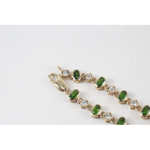 54 - 9ct gold peridot & white sapphire bracelet (8.1g)