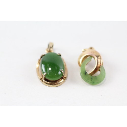 71 - 2x 9ct gold green gemstone pendants (3.3g)