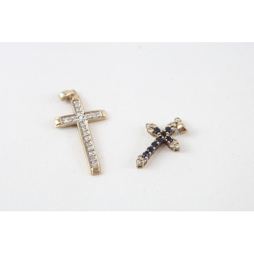 81 - 2 x 9ct gold diamond cross pendants (2.6g)