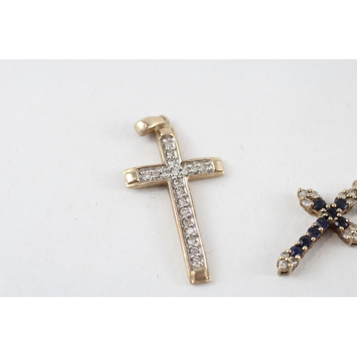 81 - 2 x 9ct gold diamond cross pendants (2.6g)