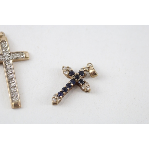 81 - 2 x 9ct gold diamond cross pendants (2.6g)