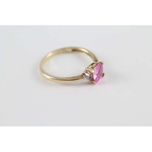 119 - 9ct gold pink sapphire single stone ring with diamond sides (1.9g) Size  O 1/2