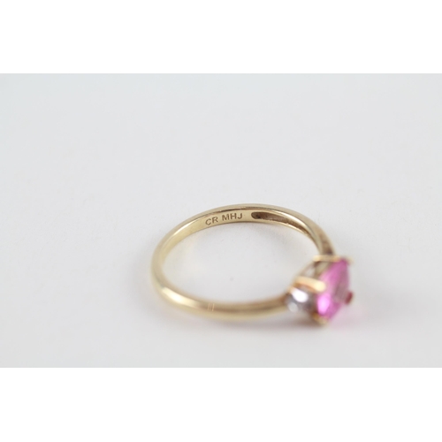 119 - 9ct gold pink sapphire single stone ring with diamond sides (1.9g) Size  O 1/2