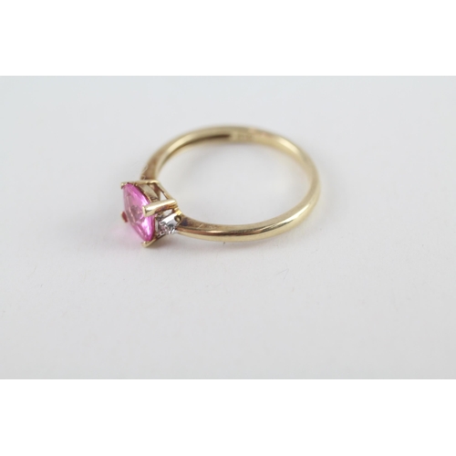 119 - 9ct gold pink sapphire single stone ring with diamond sides (1.9g) Size  O 1/2