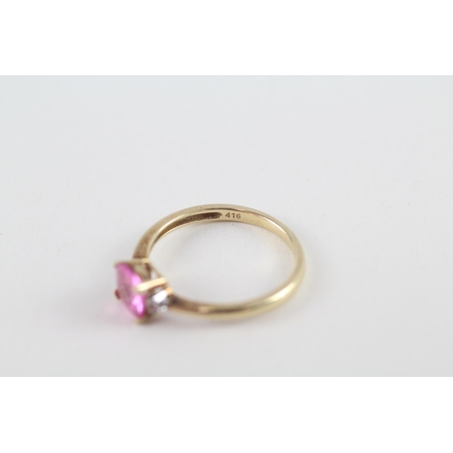 119 - 9ct gold pink sapphire single stone ring with diamond sides (1.9g) Size  O 1/2