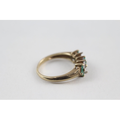 121 - 9ct gold diamond & emerald dress ring (2.4g) Size  M