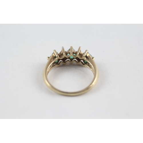 121 - 9ct gold diamond & emerald dress ring (2.4g) Size  M