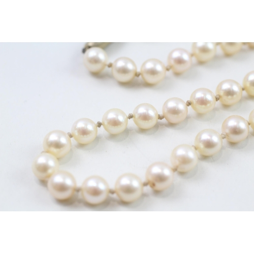 124 - 9ct gold cultured pearl necklace with diamond clasp (38g)