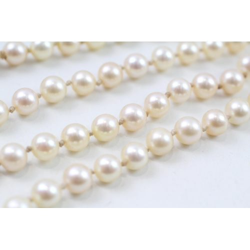 124 - 9ct gold cultured pearl necklace with diamond clasp (38g)