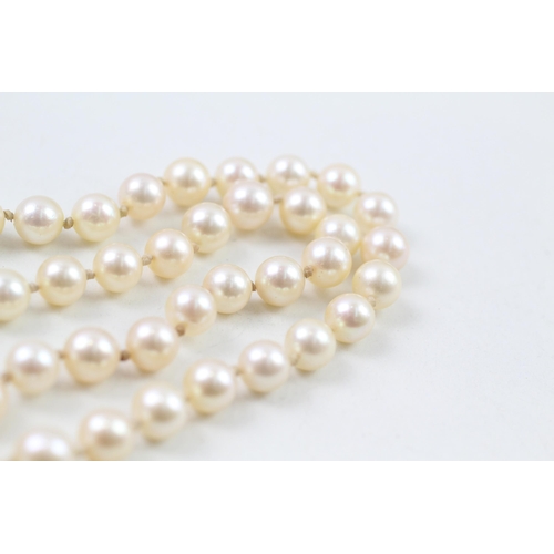 124 - 9ct gold cultured pearl necklace with diamond clasp (38g)