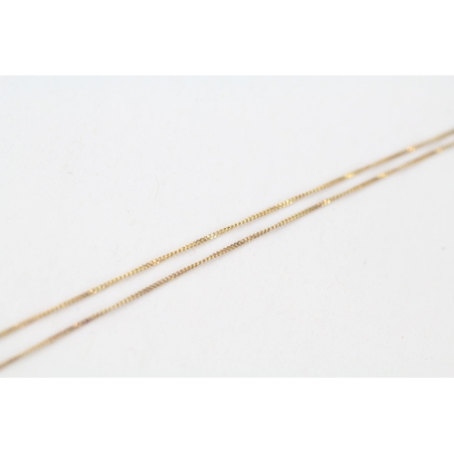 41 - 9ct gold ruby & diamond heart shaped pendant & chain (2.5g)