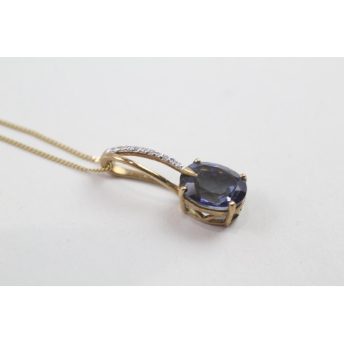 86 - 9ct gold blue gemstone & diamond pendant & chain (3.6g)