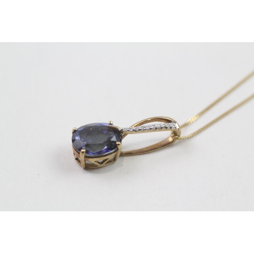 86 - 9ct gold blue gemstone & diamond pendant & chain (3.6g)