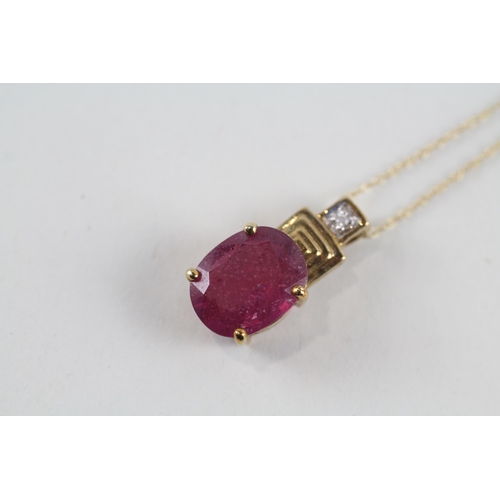 91 - 9ct gold glass filled ruby & diamond pendant & chain (2.7g)