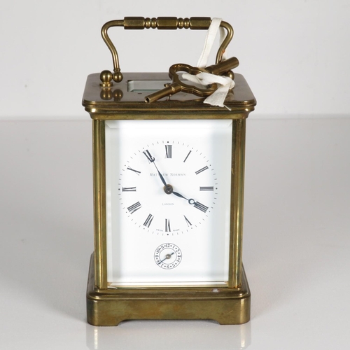 A  midsize chiming carriage clock by Matthew Norman of London Matthew Norman Switzerland movement.  Clock runs and chimes