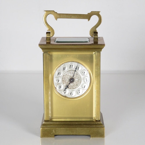 A small sized carriage clock 110mm x 70mm.  Clock requires full service