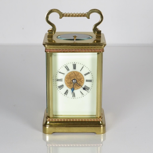 A midsize carriage clock 120mm x 70mm.  Clock requires full service