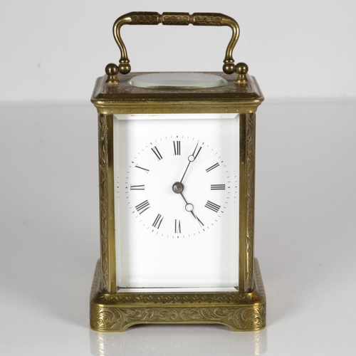 A  midsize carriage clock 110mm x 70mm.  Clock requires full service