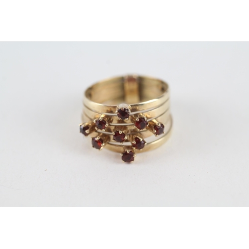 101 - 9ct gold garnet articulated five band dress ring (3.8g) Size  P 1/2