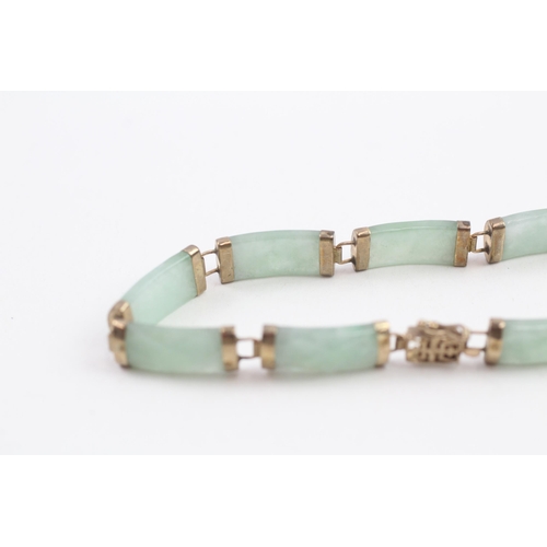 108 - 9ct gold faceted jade bracelet (10.2g)