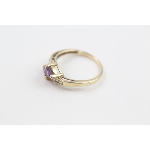 129 - 9ct gold amethyst two stone bypass ring with white gemstone set shank (2g) Size  N 1/2