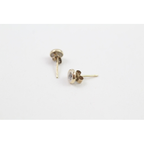 130 - 9ct gold diamond single stone stud earrings (0.7g)