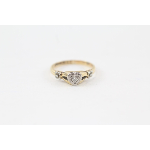 133 - 18ct gold diamond single stone ring with heart shaped set & floral shank (2.6g) Size  J 1/2