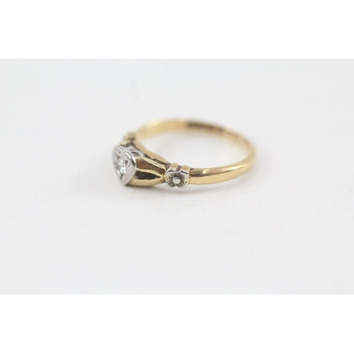 133 - 18ct gold diamond single stone ring with heart shaped set & floral shank (2.6g) Size  J 1/2