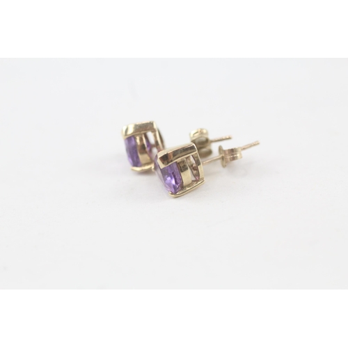 159 - 2 x 9ct gold amethyst stud earrings (3.3g)