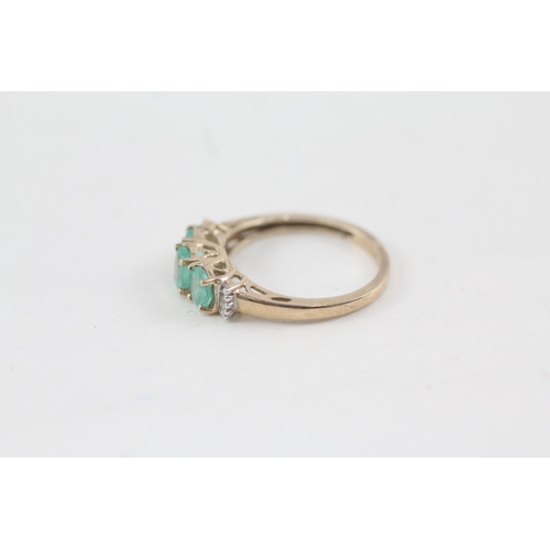 171 - 9ct gold emerald three stone ring with diamond sides (1.8g) Size  N 1/2