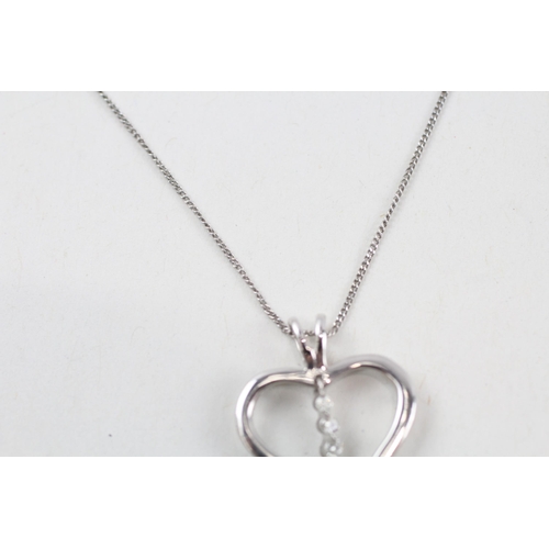 62 - 9ct white gold diamond heart pendant necklace (1.7g)