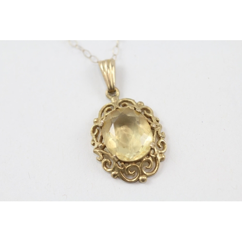 64 - 9ct gold citrine single stone pendant with openwork frame necklace (2.6g)