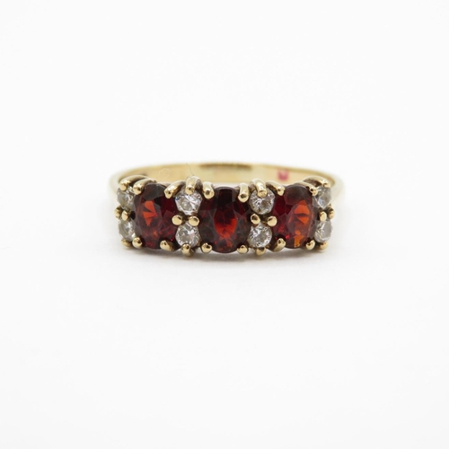 8 - HM 9ct gold dress ring with garnets and white stones (2.5g) Size  R