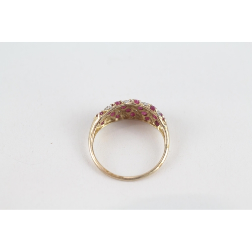 81 - 9ct gold diamond & ruby dress ring (1.8g) Size  P